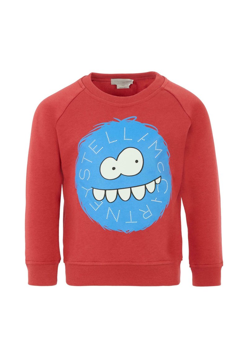 Felpa rossa con un grande grafico circolare blu rappresentante un volto, con grandi occhi e un ampio sorriso. Collo rotondo e polsini a coste.