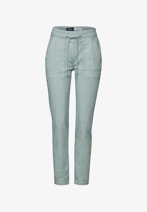 Vihreät juoksuhousut pehmeästä kankaasta, joustava vyötärönyöri, kaksi sivutaskua ja kapeneva lahkeiden muotoilu.