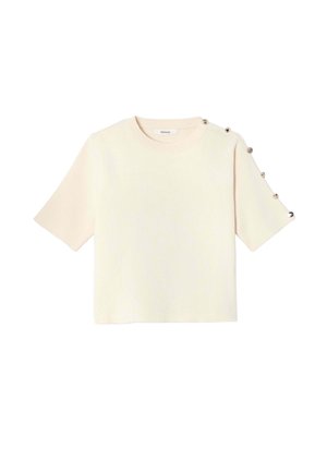 Pull à manches courtes de couleur crème avec col rond et boutons décoratifs argentés le long d'une épaule et d'une manche.