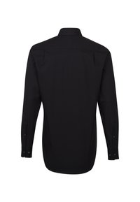 Maglietta nera a maniche lunghe con colletto, texture liscia, polsini abbottonati e orlo dritto. Presenta un design posteriore senza cuciture.