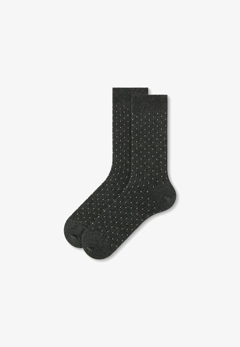 Par de calcetines de caña corta de color gris oscuro con pequeños lunares de color claro distribuidos de manera uniforme por toda la tela.
