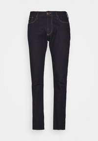 Mörkblå denimjeans med slim fit, med ljusa sömmar, standard fem-fickorsdesign och knappstängning fram.