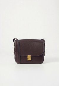 Brown leather crossbody bag with a fold-over flap, gold hardware clasp, and decorative studs along the side. Smooth texture, structured design.