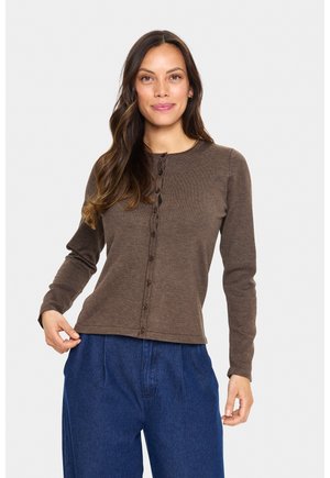Brown long-sleeve cardigan with a round neckline, featuring a button-down front and smooth textured fabric. Blue wide-leg pants worn below.