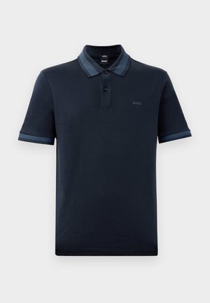 Navy polo shirt featuring a textured collar with light blue stripes, two buttons at the neck, short sleeves, and a subtle logo on the chest.