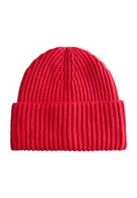 Red knitted beanie hat with ribbed texture and a folded cuff. Features vertical patterning and a soft, stretchy material.