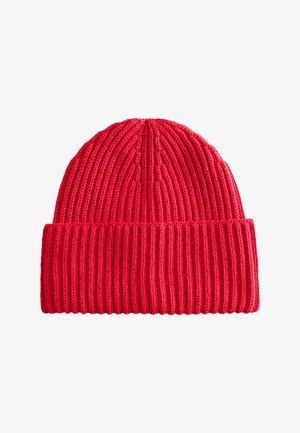 Red knitted beanie hat with ribbed texture and a folded cuff. Features vertical patterning and a soft, stretchy material.