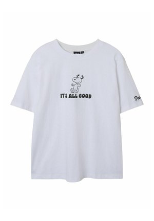 T-shirt en coton blanc avec un motif noir de Snoopy et le texte "C'EST TOUT BON" à l'avant, manches courtes et col rond.