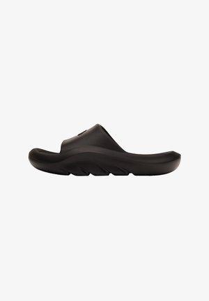 Sandale noire à glissière avec une tige en caoutchouc lisse, une semelle rembourrée et un design profilé. Dotée d'une semelle extérieure nervurée pour une traction optimale.