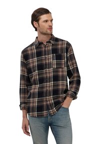 Camicia a quadri con bottoni, caratterizzata da tonalità nere, beige e grigie. Ha una tasca frontale, maniche lunghe e una vestibilità comoda. Realizzata in tessuto morbido.