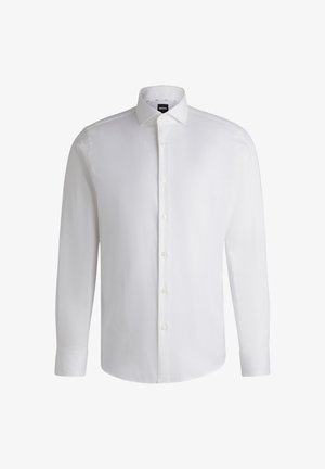 Chemise blanche à manches longues en coton lisse, dotée d'un col classique, d'une patte de boutonnage complète et de poignets à bouton. Design minimaliste.
