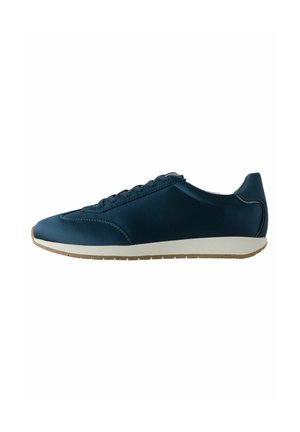 Navy blue athletic shoes with a smooth upper, lace-up design, and a minimalistic rubber sole. Features a rounded toe and subtle decorative stitching.