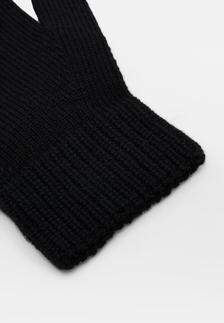 Guante de lana negro con textura acanalada. Presenta un puño ajustado y un diseño clásico, adecuado para mantener el calor y ofrecer protección.