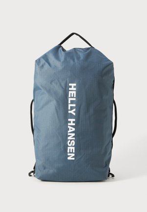 Blue waterproof backpack with black straps and a top handle. Features vertical ribbed texture and bold white "HELLE HANSEN" logo.