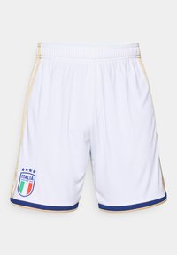 White athletic shorts with gold side stripes, blue accent hem, and Italy national team emblem featuring stars and tricolor shield.
