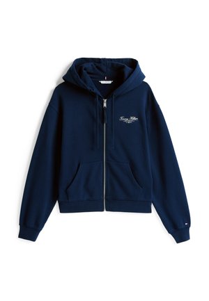 Sweat-shirt zippé bleu marine avec une poche avant, capuche à cordons, et logo brodé sur la poitrine. Fabriqué en tissu doux et texturé.