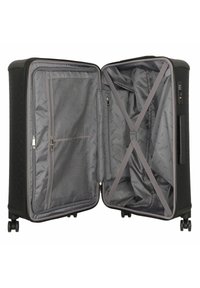 Valise rigide noire avec un intérieur gris, dotée d'une poche zippée, d'un compartiment en maille et de sangles croisées pour sécuriser les objets.