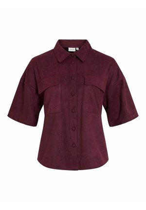 Camicia bordeaux a maniche corte in tessuto morbido e strutturato. Presenta una chiusura frontale con bottoni, due tasche sul petto e un colletto classico.