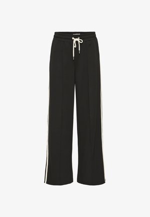 Pantaloni di felpa neri a gamba larga con vita regolabile, caratterizzati da strisce laterali in crema a contrasto e una superficie liscia.