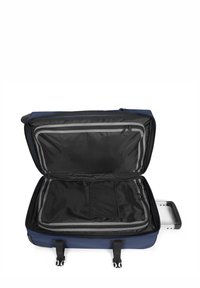 Valigia a mano blu navy con interno nero con cerniera, tasca in rete e manico estraibile. Dotata di due cinturini con fibbia per il contenuto.
