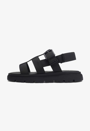Sandalias planas negras de dedo con anillo | | New Collection SS26 Sandalias planas negras de dedo con anillo | | New Collection SS26