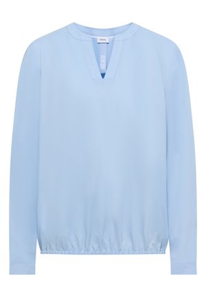 Blouse manches longues bleu clair en tissu doux, avec un col en V et un ourlet élastiqué pour une coupe décontractée.