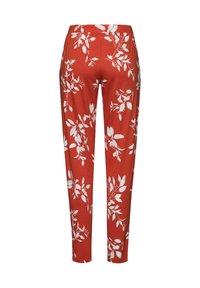 Rode broek met een wit bloemenpatroon, gemaakt van zachte stof, met een rechte snit en een elastische tailleband. Sluit strak aan.