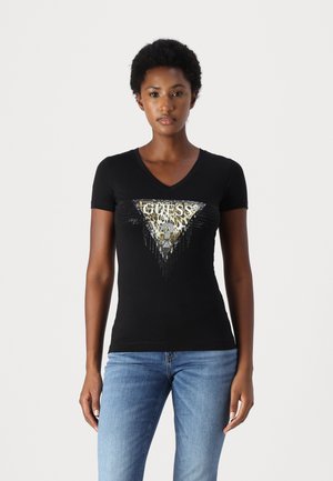 Black short-sleeve T-shirt with a V-neck, featuring a triangular gold and silver graphic with animal print, embellished with rhinestones.
