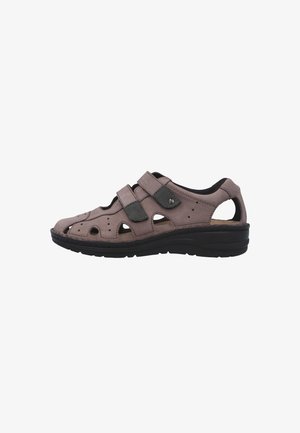 Men’s brown leather sandal with two adjustable black straps and cushioned black sole, ventilated upper with cut-out design.