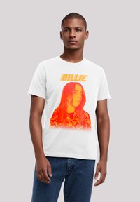 White cotton t-shirt featuring an orange gradient graphic of a portrait with the text "BILLIE" above. Short sleeves and round neck design.