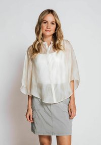 Translucent white button-up blouse with flutter sleeves and a relaxed fit, paired with a light gray knee-length skirt featuring pockets.