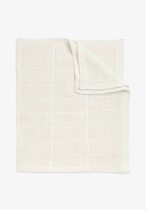 Hvid strikket plaid med et tekstureret gittermønster. Blødt, åndbart materiale med en subtil glans og færdige kanter.