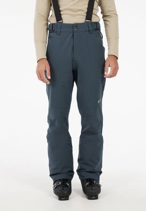 Mannelijke blauwe skibroeken met verstelbare zwarte bretels, een hoog elastische taille en verstevigde kniestukken. Knopen- en ritsluiting.