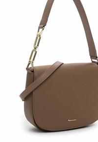 Brown leather shoulder bag with a rounded shape, featuring a smooth texture, a long strap, and gold-tone chain accent near the attachment.