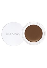 Crema RMS Beauty di tonalità marrone in un contenitore circolare bianco con una texture liscia e una finitura lucida, dotato di un coperchio rimovibile.