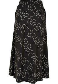 Black skirt with white floral pattern, elastic waistband, knee-length cut, lightweight fabric, featuring side pockets and flowy design.