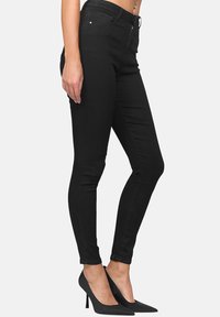 Elara STRETCH - Vaqueros pitillo - schwarz