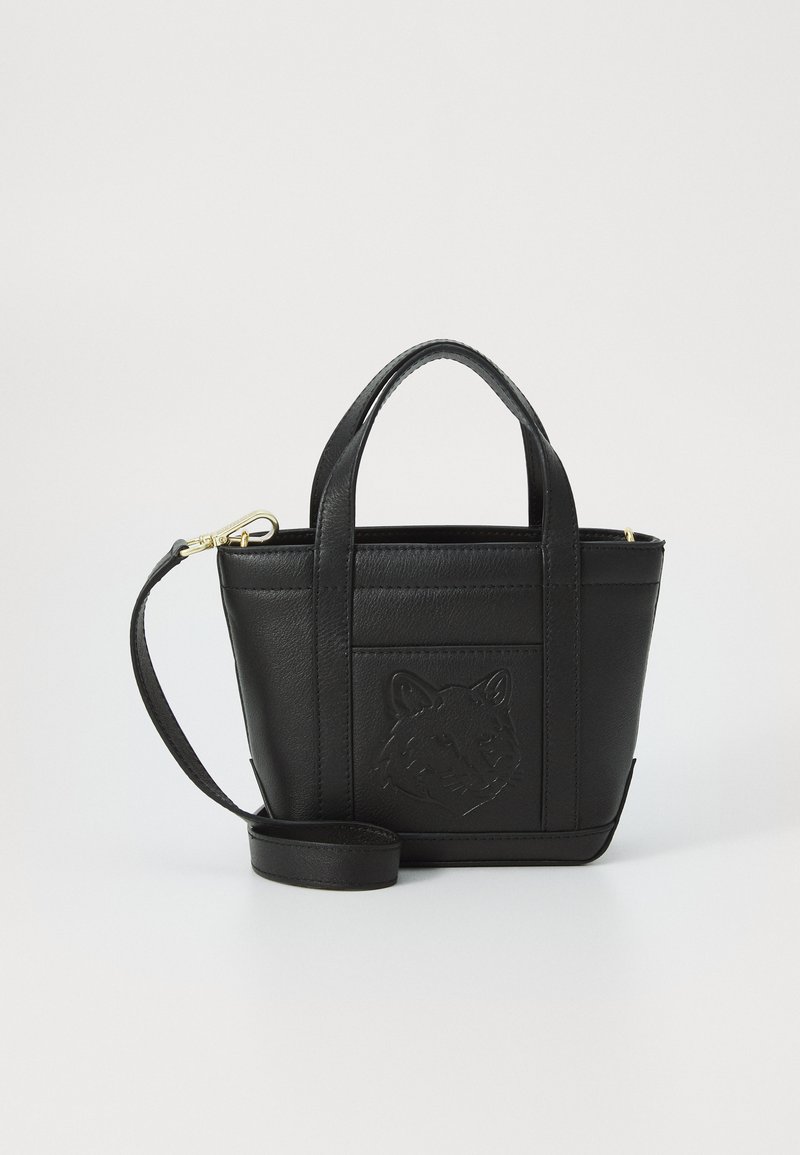 Black leather handbag with a textured finish, featuring short handles, a removable strap, and an embossed fox head design on the front.
