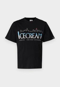 Black cotton t-shirt with short sleeves featuring a white and blue skyline graphic and "ICECREAM LONDON UNITED KINGDOM" text.
