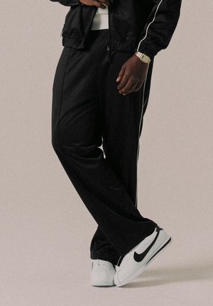 SCRIPT UNISEX - Pantalon de survêtement - black