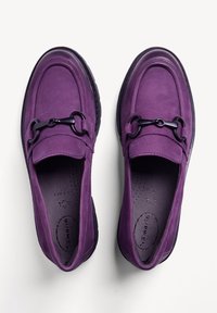Purple loafers made of soft suede with a black chain accent and textured detail, featuring a cushioned insole and round toe design.
