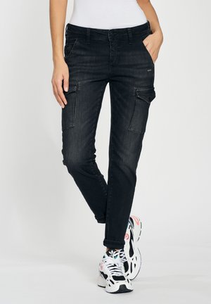 Black denim cargo pants with slim fit, multiple pockets, and rolled cuffs. Textured finish with slight stretch for comfort and mobility.