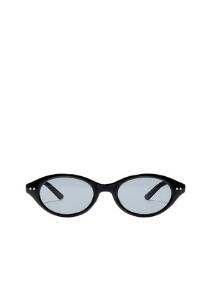 Schwarze ovale Sonnenbrille mit dünnem Gestell und kleinen goldenen Punkten nahe den Scharnieren, mit leicht getönten Gläsern.