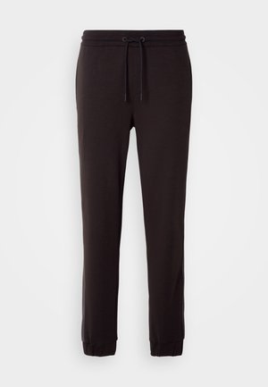 Pantalones de chándal negros hechos de una tela suave, con una cintura elástica y cordón, piernas ajustadas y puños acanalados.