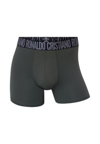 Herre boxer briefs i mørkegrønt stof med bredt sort elastikbånd, hvor "CRISTIANO RONALDO" er tydeligt trykt. Glat tekstur.