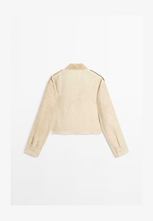 Giacca beige tagliata in tessuto testurizzato con colletto, maniche lunghe e polsini con bottone, priva di chiusure visibili sul retro.