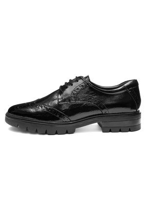 Black leather men's brogue shoe with wingtip detailing, thick lug sole, and five-eyelet lace-up closure, shown in side profile.