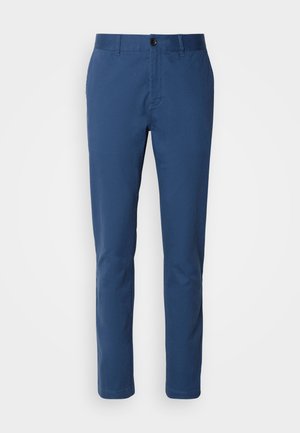 Navy blue cotton chinos with a slim fit; features a standard waistband, front pockets, and a single button closure. Smooth texture.