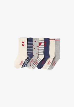Seven pairs of children's socks in white, blue, and gray with hearts and striped patterns, arranged side by side.