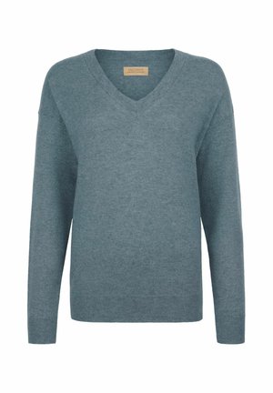 Pull en cachemire bleu clair avec un décolleté en V, des manches longues et des poignets côtelés. Texture douce et coupe décontractée, avec un minimum de détails.